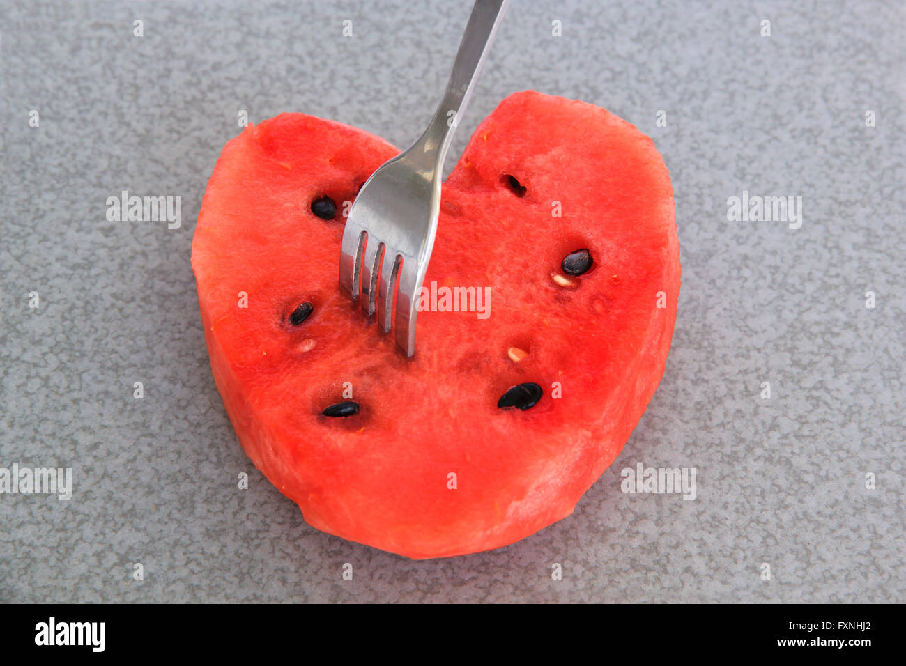 Anguria frutto rebbio dip su roccia Foto Stock