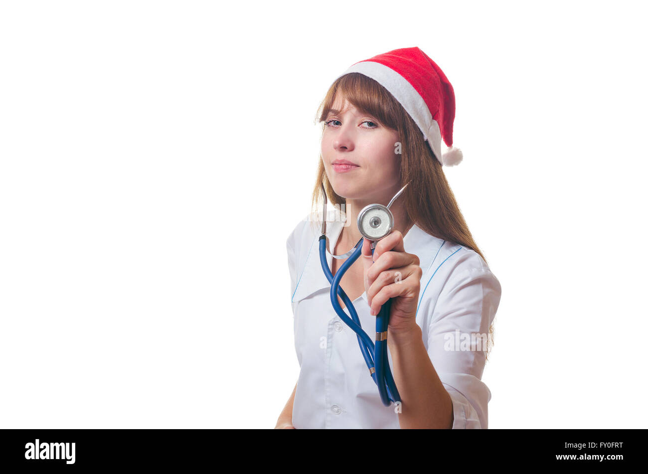 Il medico in un nuovo anno di cap ascolta uno stetoscopio Foto Stock