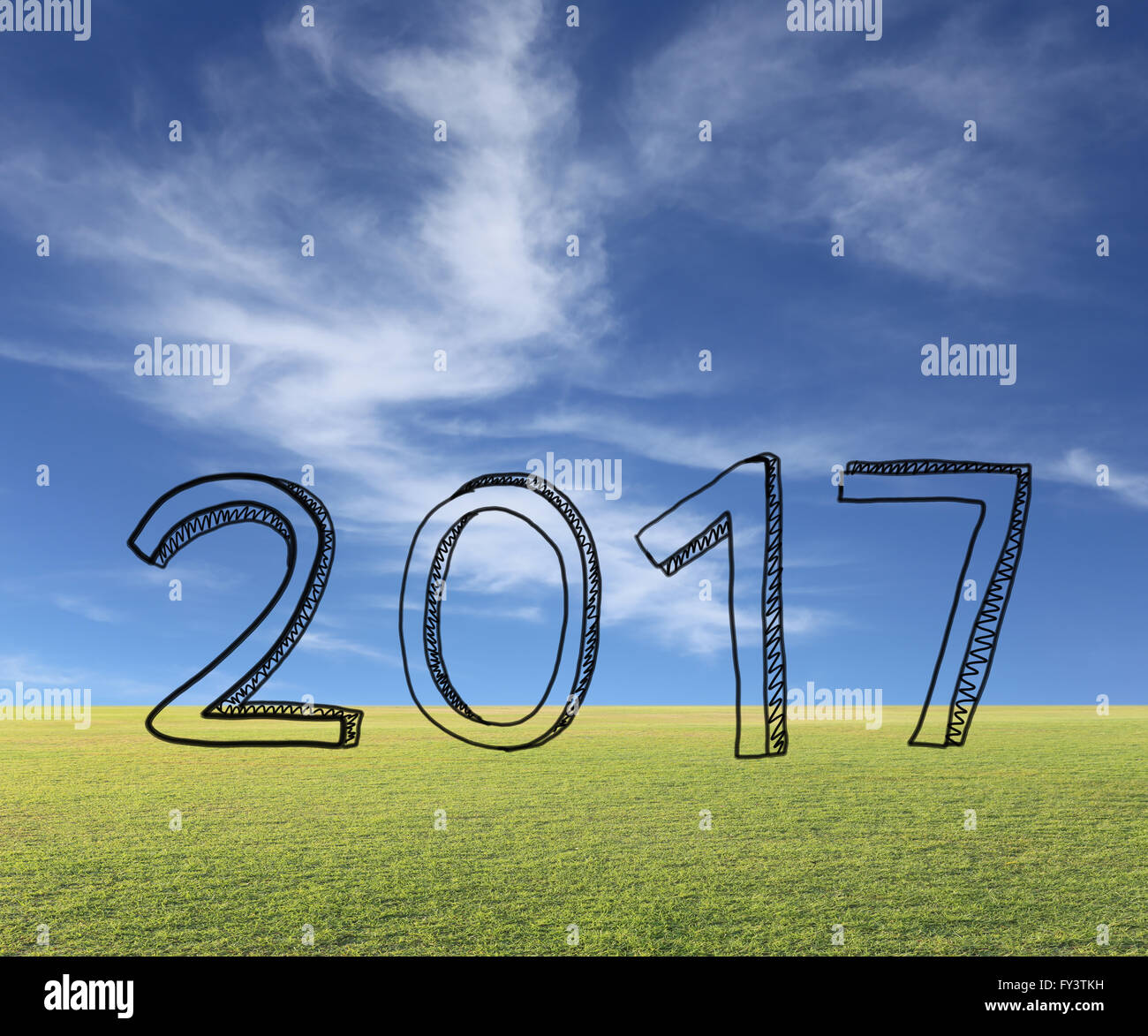 Disegnata a mano numeri mostrano 2017 anno su sfondo naturale. Foto Stock