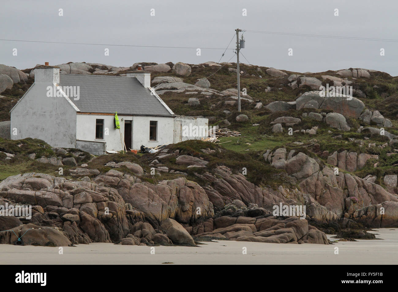 Seashore cottage sull isola a Rosses, County Donegal, Irlanda. Foto Stock