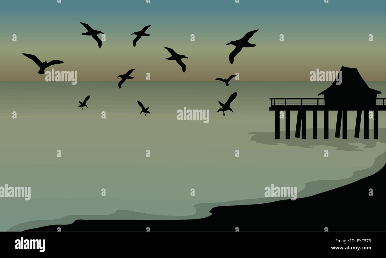 Silhouette di capanne e bird in spiaggia Illustrazione Vettoriale