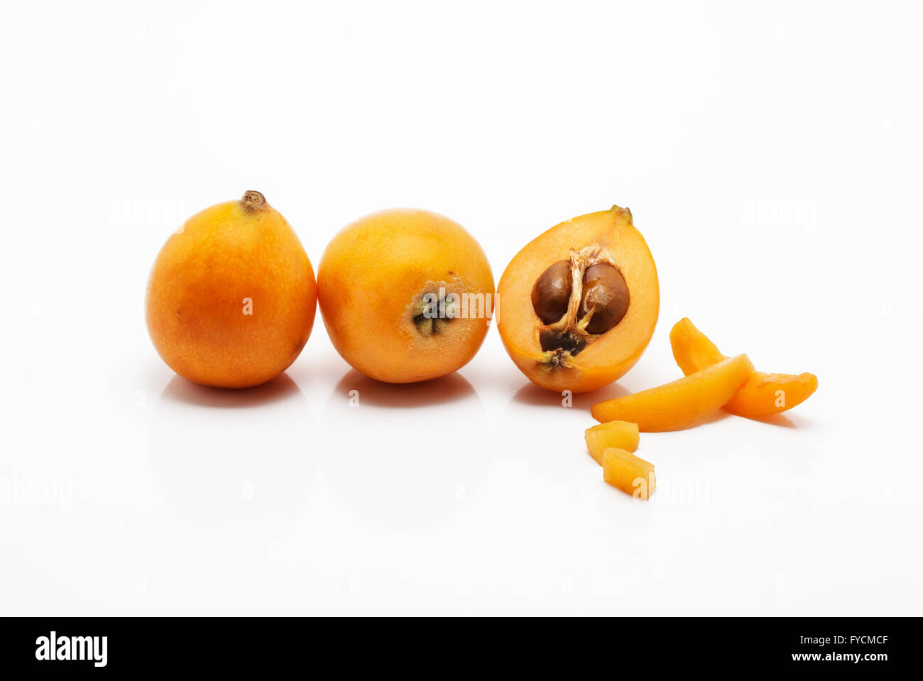 Tre nespola frutti, Nisperos spagnolo Foto Stock