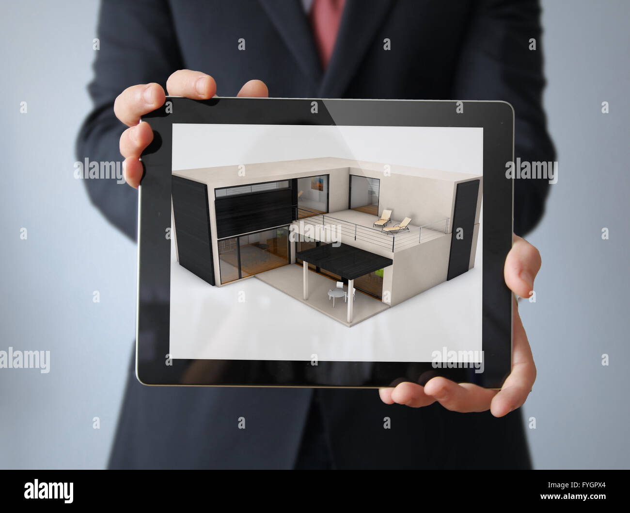 Concetto di architettura modulare: calcestruzzo house design su un imprenditore tablet Foto Stock