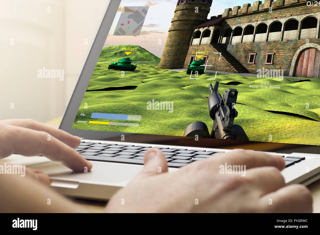 Il concetto di gioco: Uomo che utilizza un notebook per giocare il gioco di guerra Foto Stock