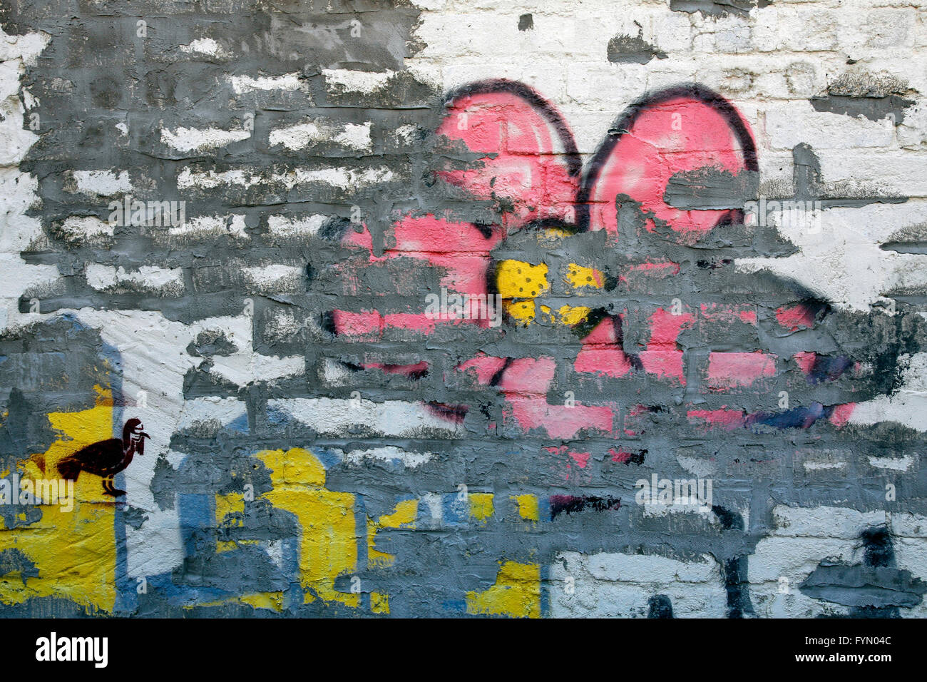 Fiore di Graffiti su un muro di mattoni Foto Stock