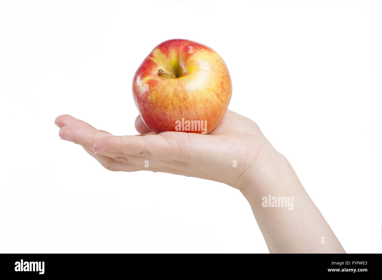 Apple in una femmina di mano. In isolamento. Foto Stock