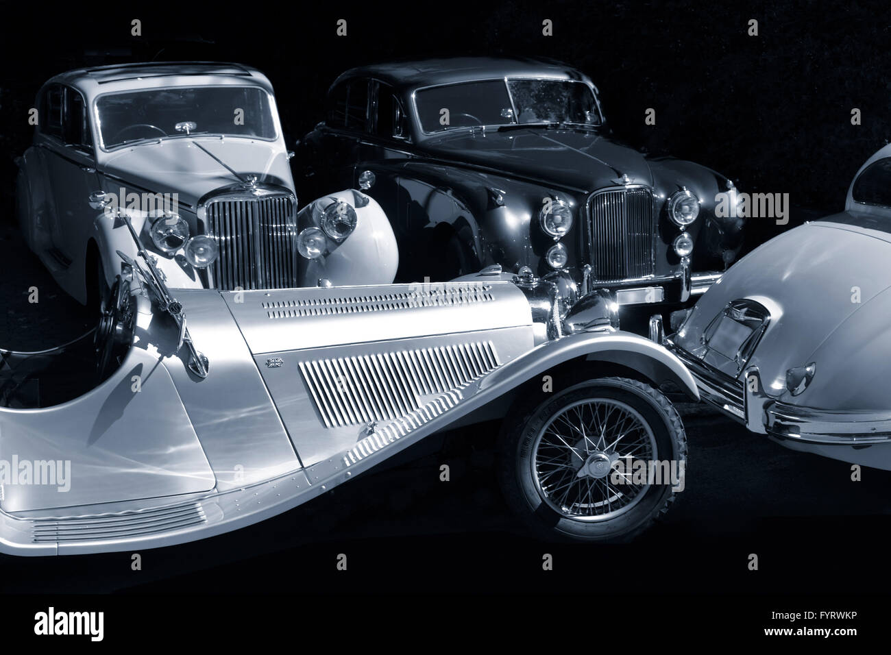 Quattro vetture classiche (Jaguar) Foto Stock