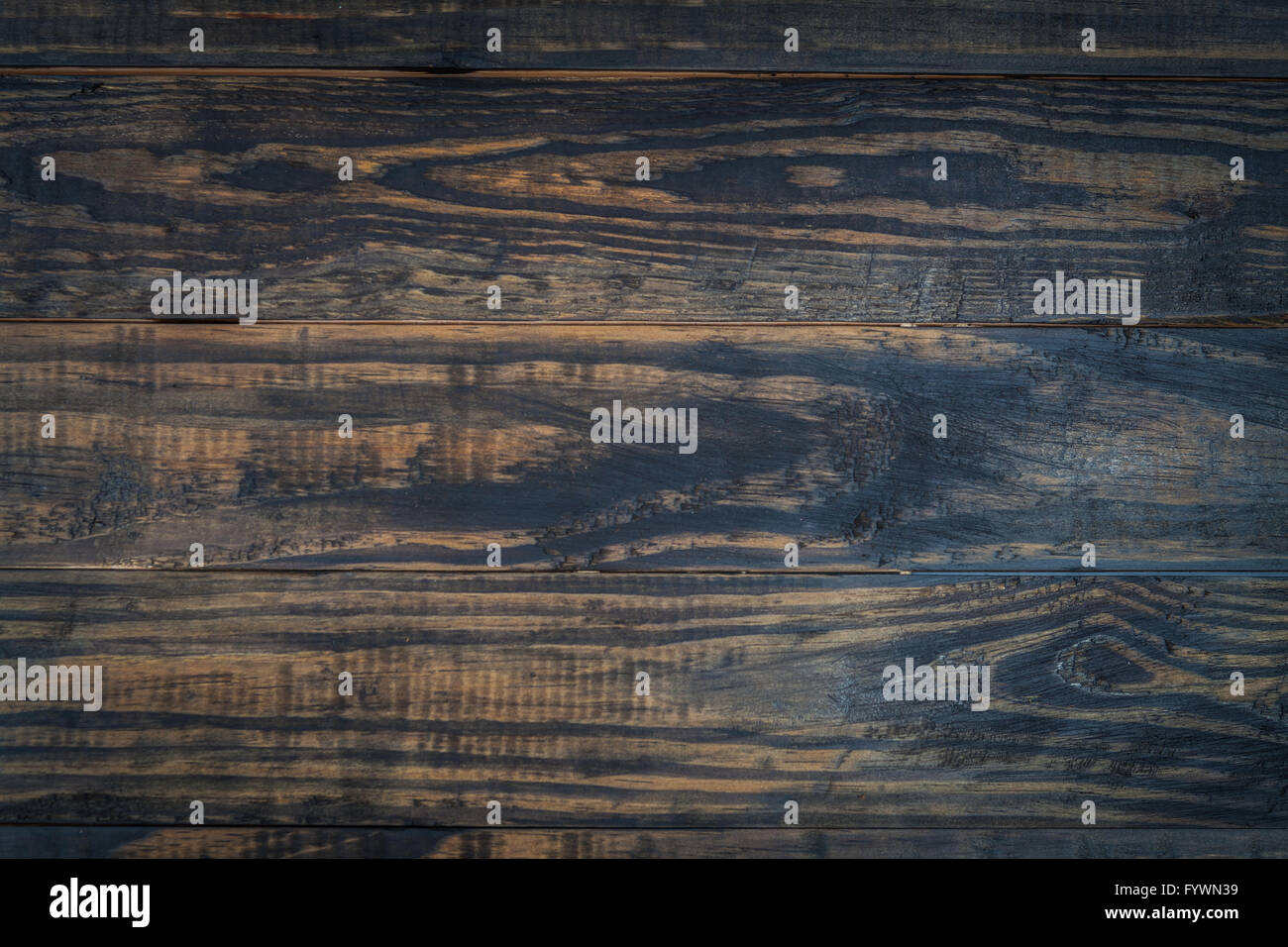 In legno a trama scuro dello sfondo. Naturale di tavole di legno. Foto Stock