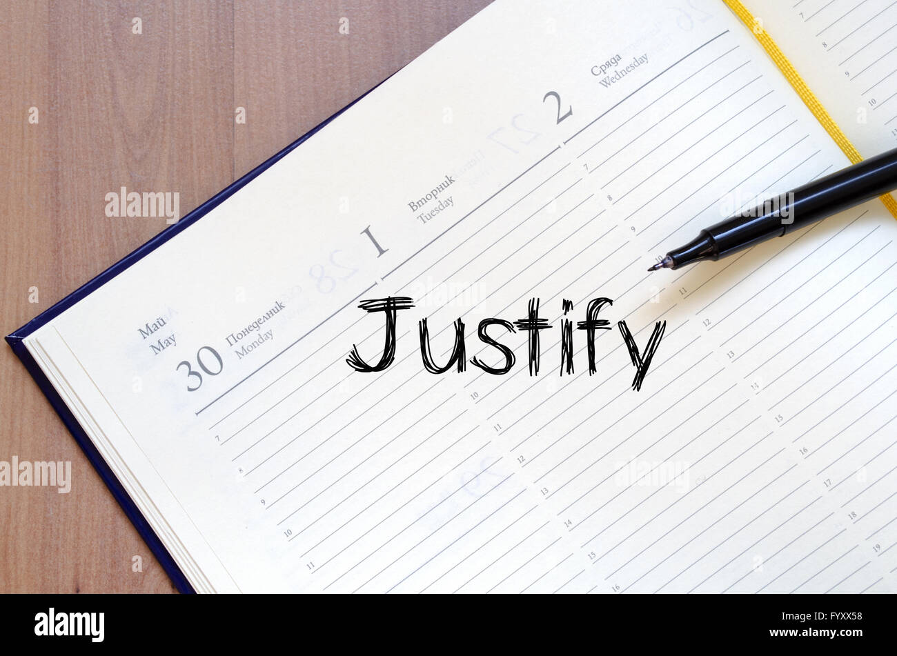 Giustificare scrivere su notebook Foto Stock