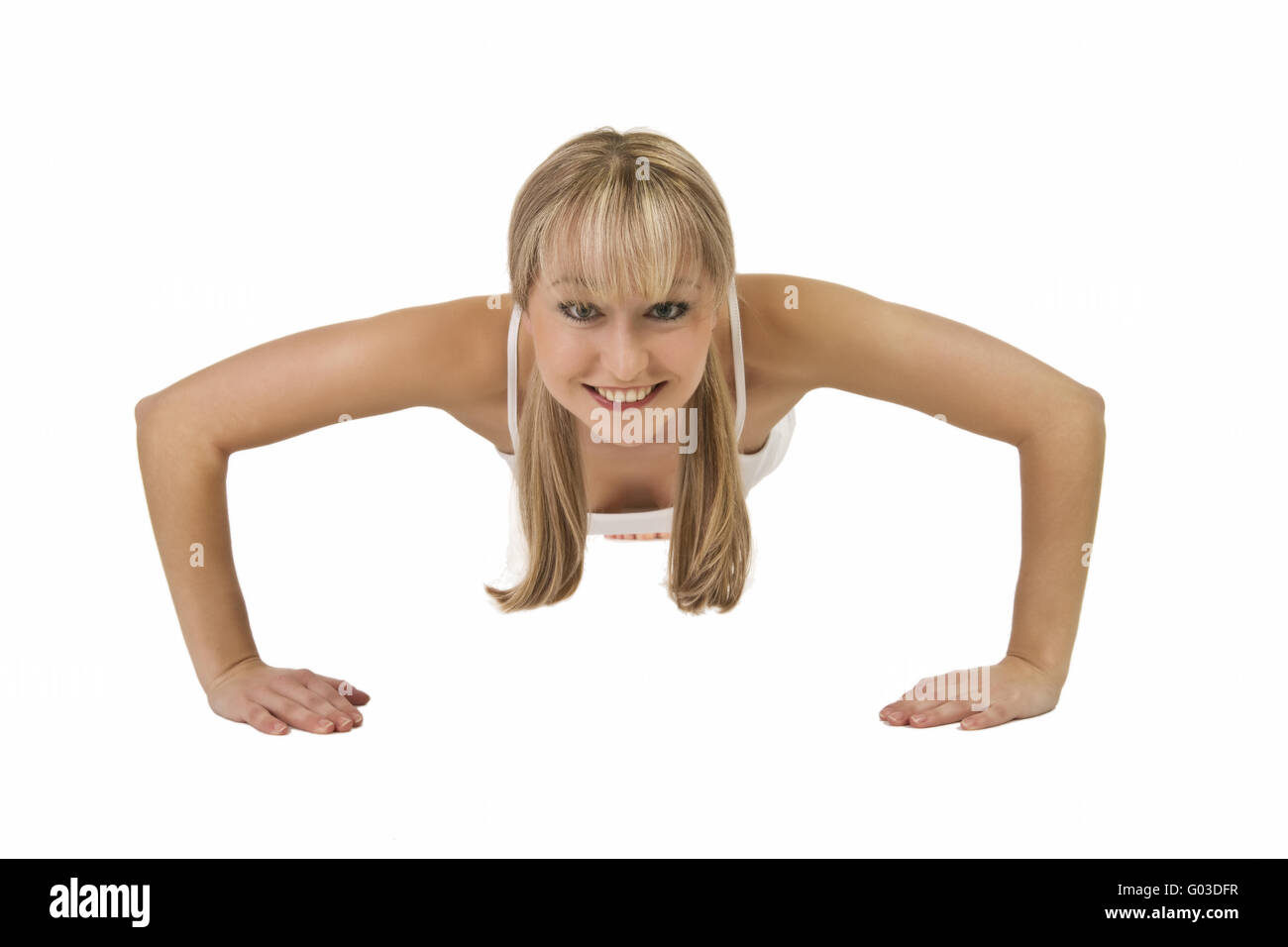 Giovane donna bionda facendo push-up Foto Stock