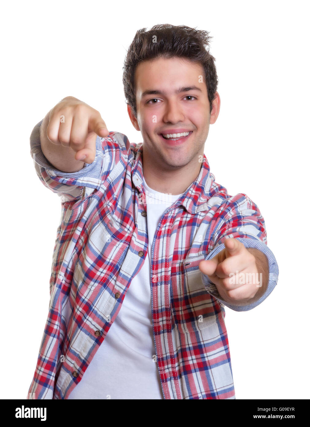 Ridendo ispanico ragazzo puntando con entrambe le mani a Foto Stock