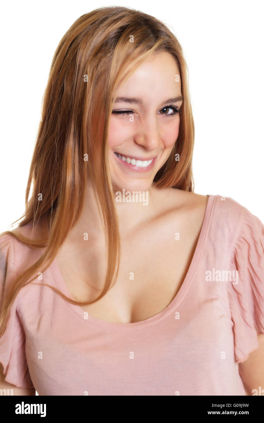 Winking donna con capelli lunghi biondi Foto Stock