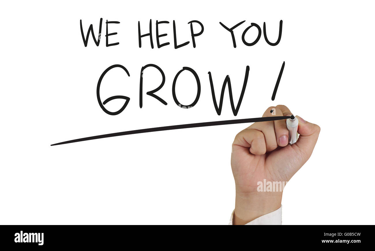 Motivazionali di concetto di immagine di una mano che tiene pennarello e scrivere vi possiamo aiutare a crescere isolato su bianco Foto Stock
