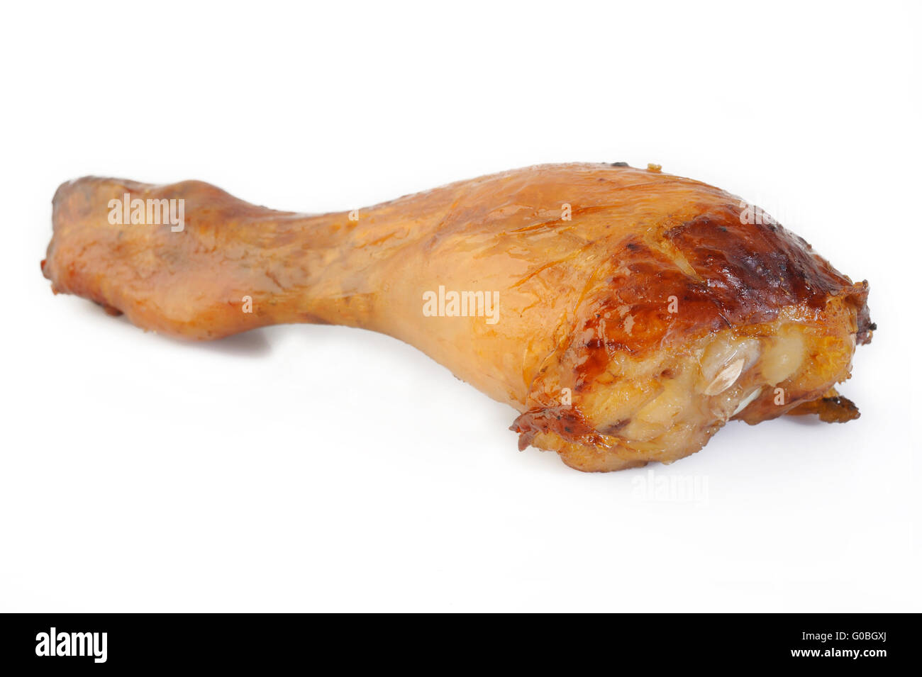 Il pollo al forno coscia su sfondo bianco Foto Stock