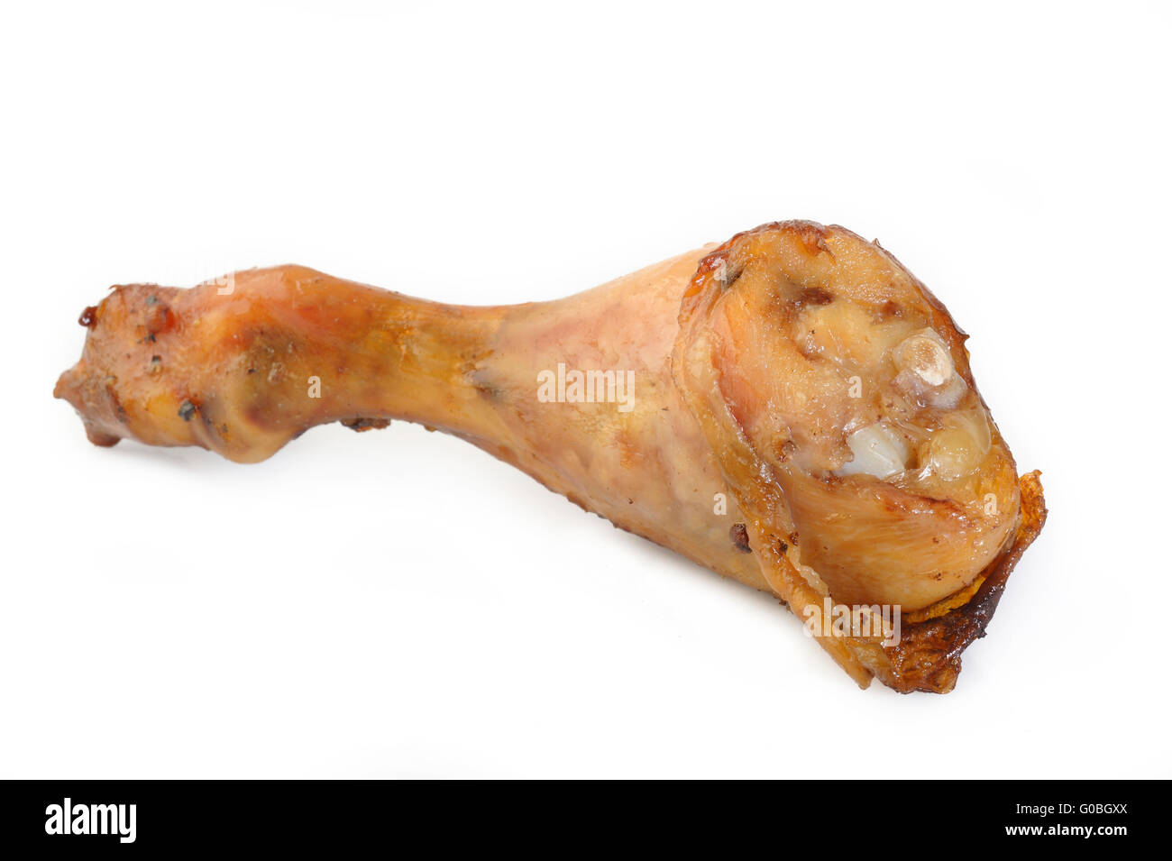 Il pollo al forno coscia su sfondo bianco Foto Stock