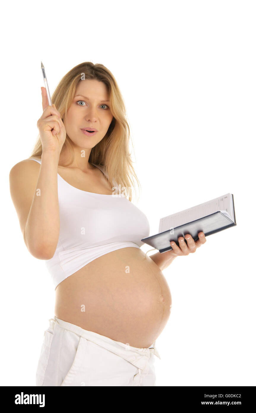 Stupito per la donna incinta con un blocco note Foto Stock