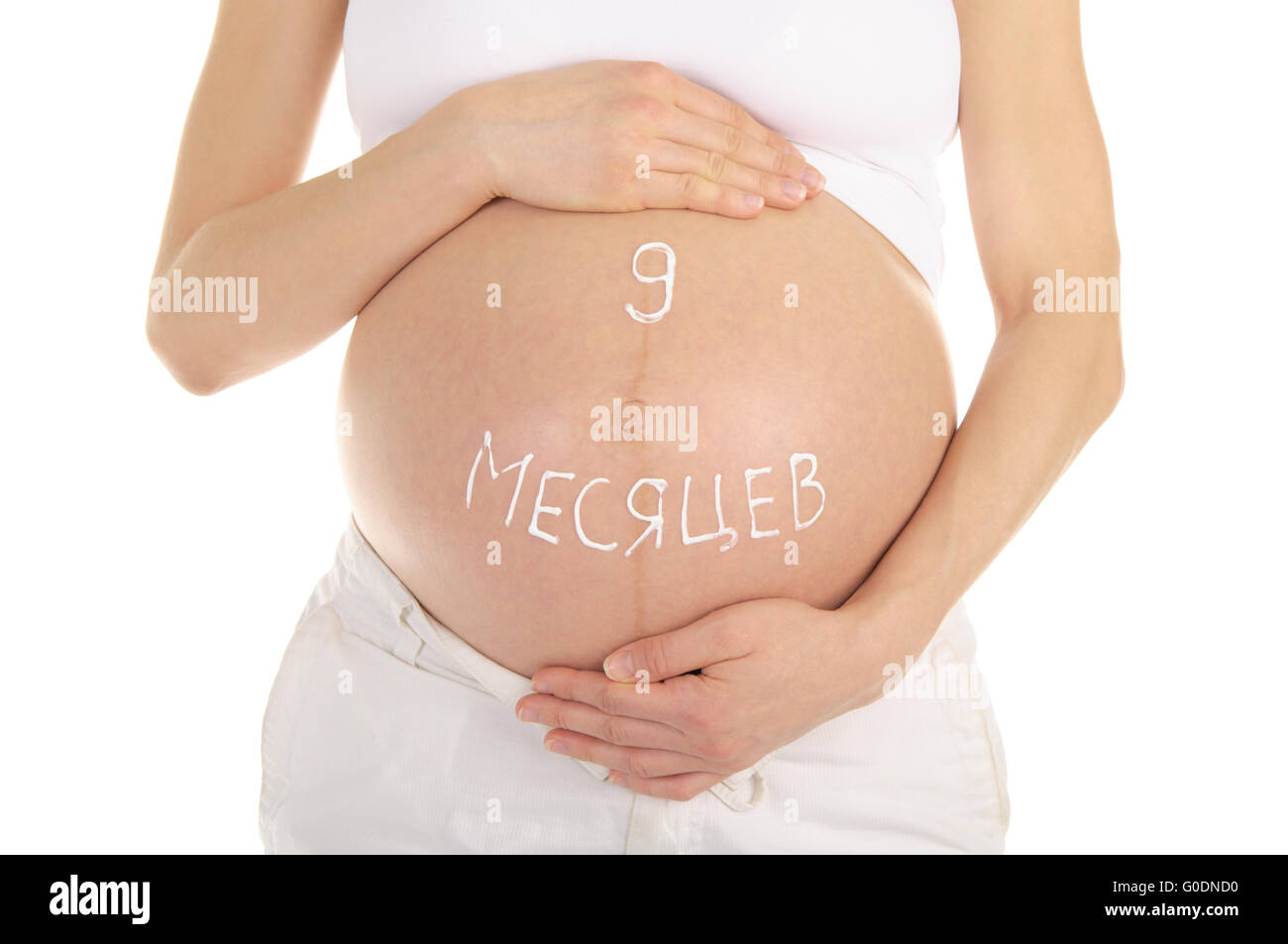 Donna incinta il ventre con parole nove mesi Foto Stock