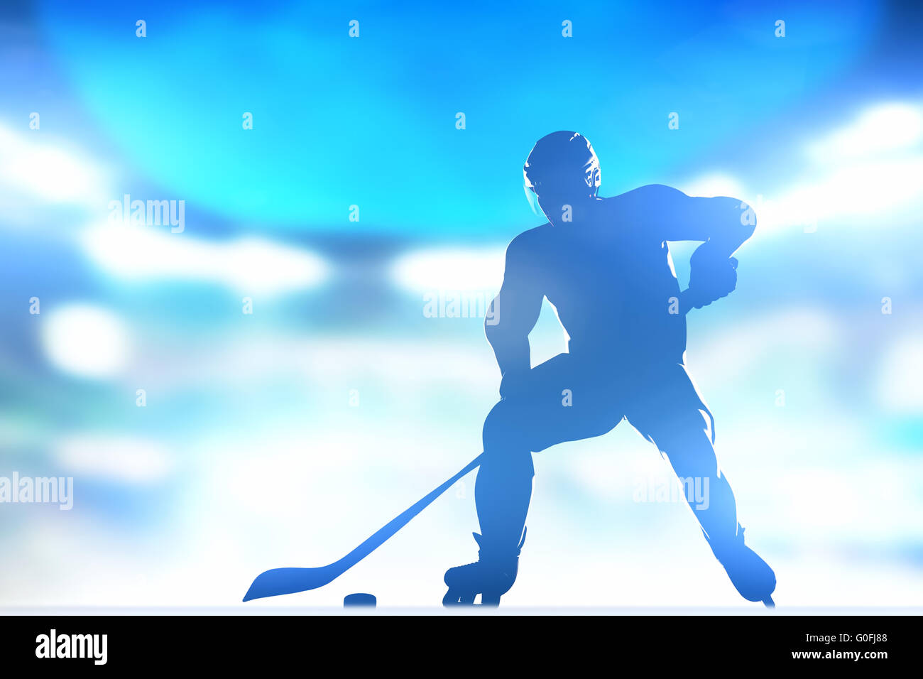 Giocatore di hockey sul ghiaccio con un puck. Full arena luci notturne Foto Stock