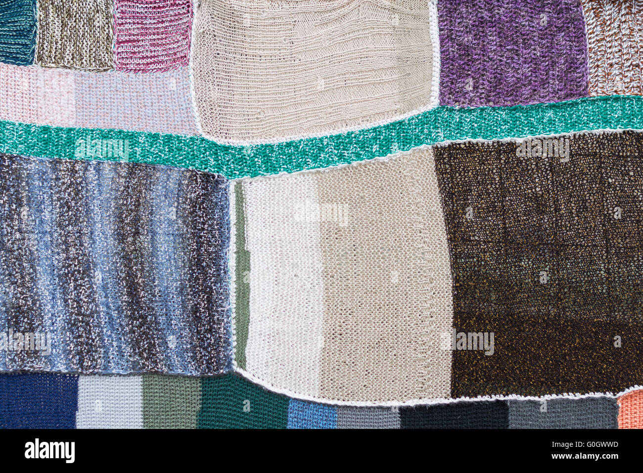 Colorate le parti di maglia collegato a un mosaico Foto Stock