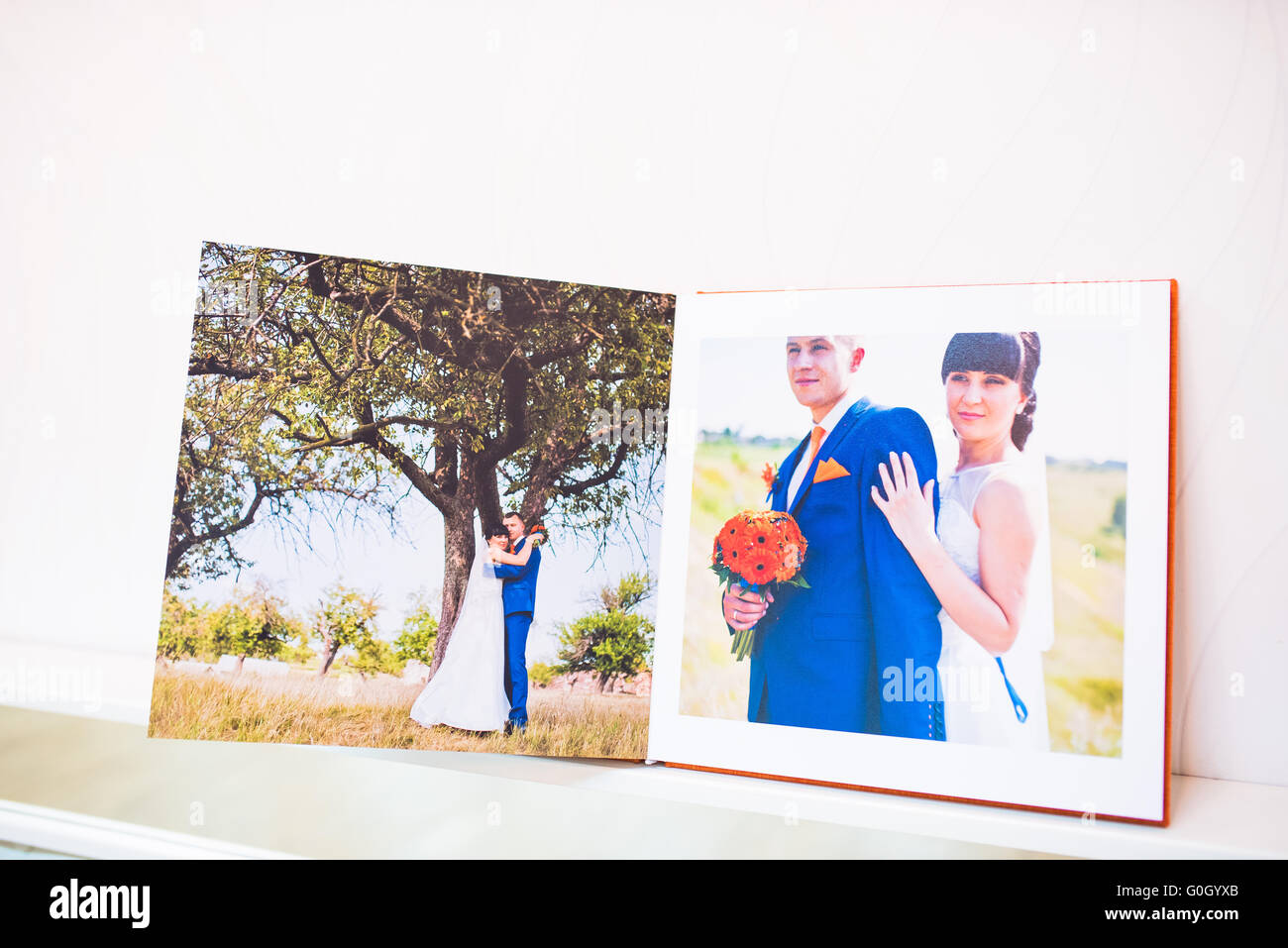 Blu e arancione nozze tessili libro foto e album Foto Stock