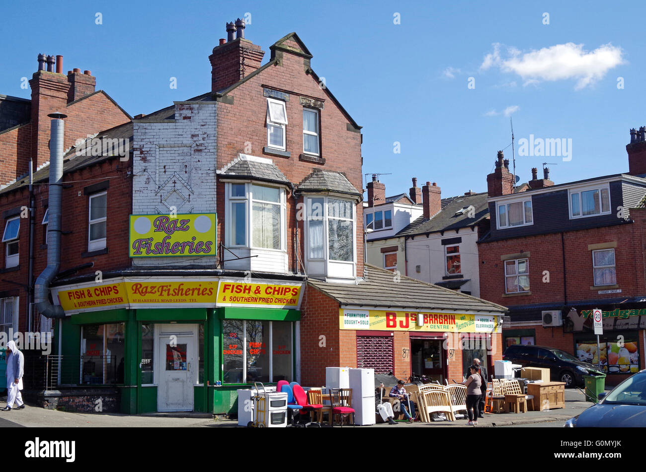 Strada Harehills, fine della terrazza case diventano negozi Foto Stock