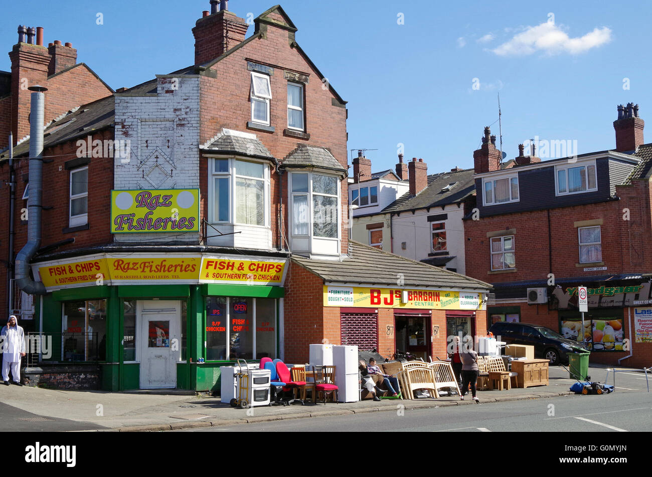 Strada Harehills, fine della terrazza case diventano negozi Foto Stock