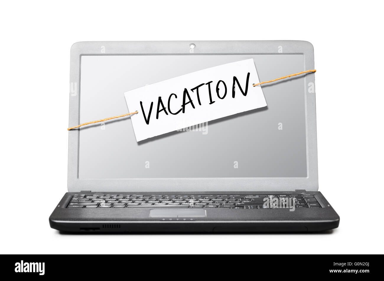 Computer portatile con nota di vacanza Foto Stock