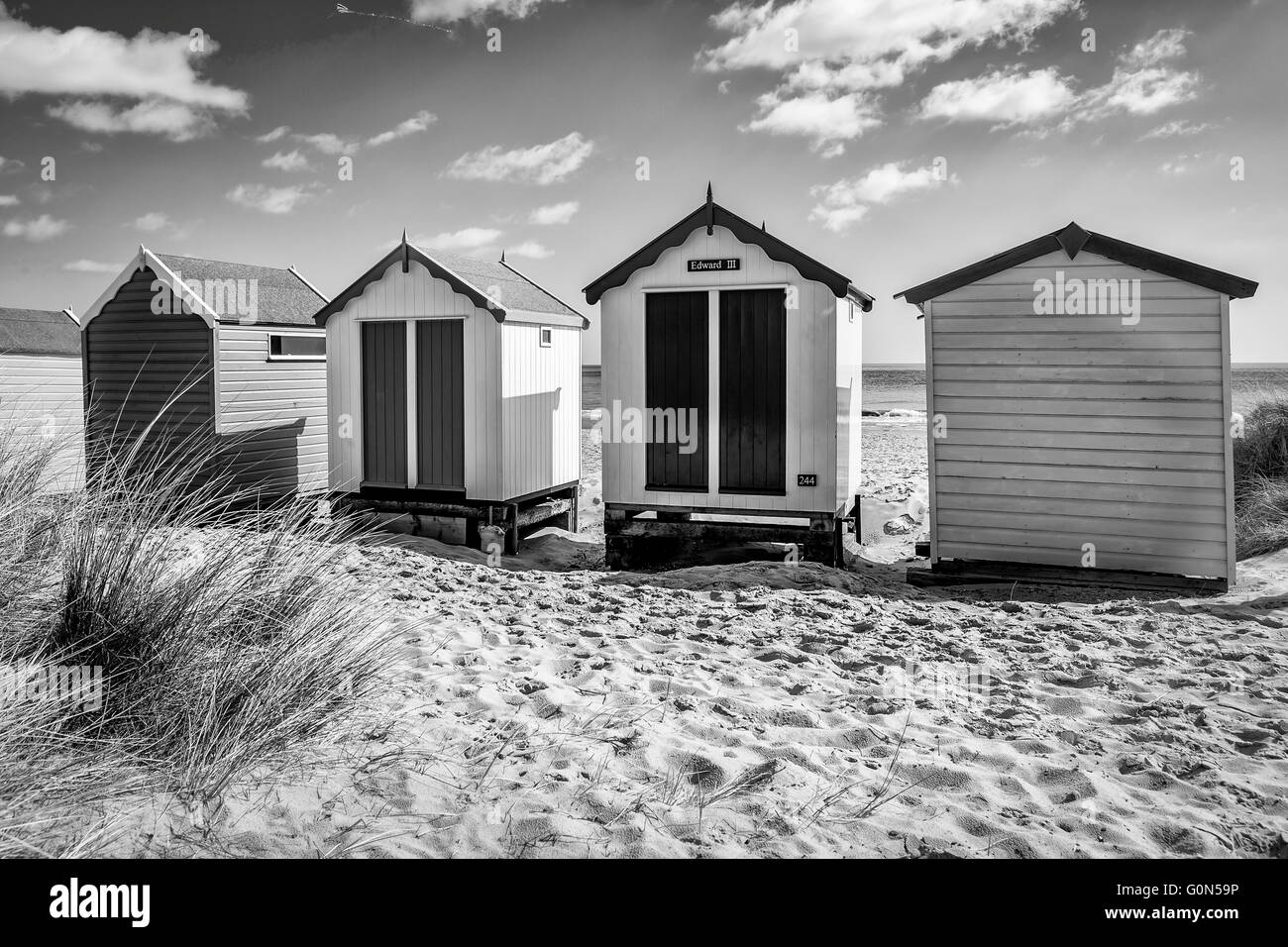 Rifugi sulla spiaggia a Southwold sulla costa di Suffolk Foto Stock