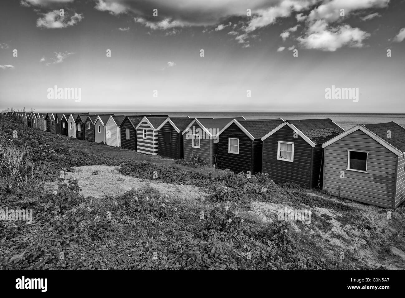 Rifugi sulla spiaggia a Southwold sulla costa di Suffolk Foto Stock