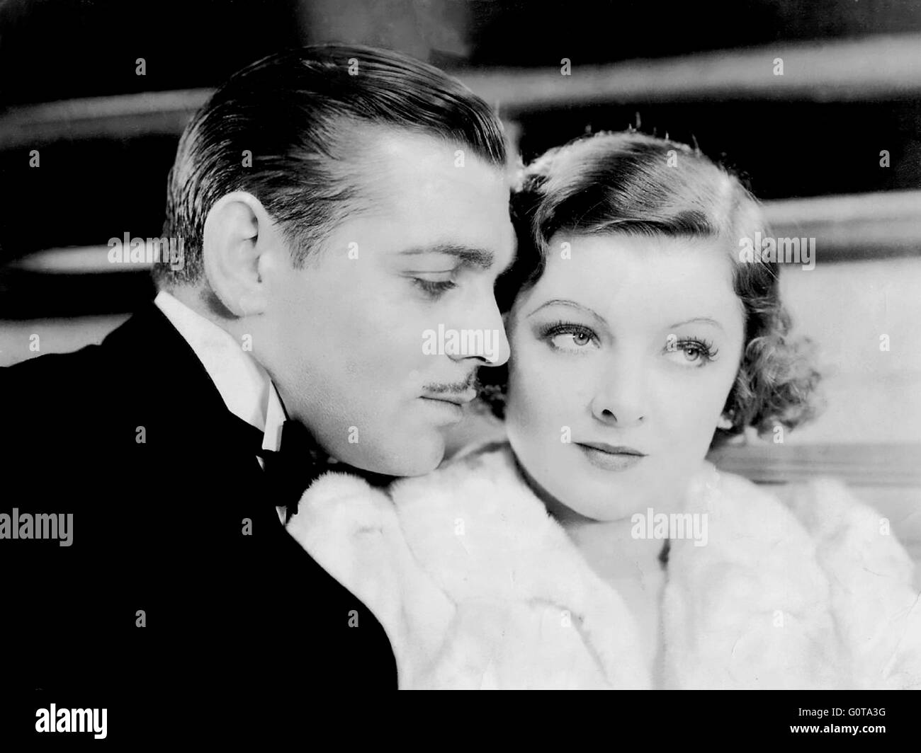 Clark Gable e Mirna Loy / Manhattan melodramma / 1934 diretto da W.S. Van Dyke (Metro Goldwyn Mayer) Foto Stock