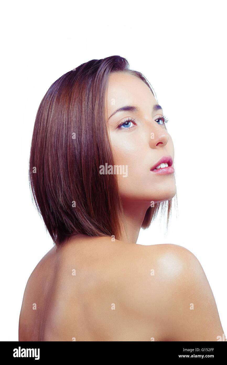 Ritratto di una giovane donna che guarda al lato Foto Stock