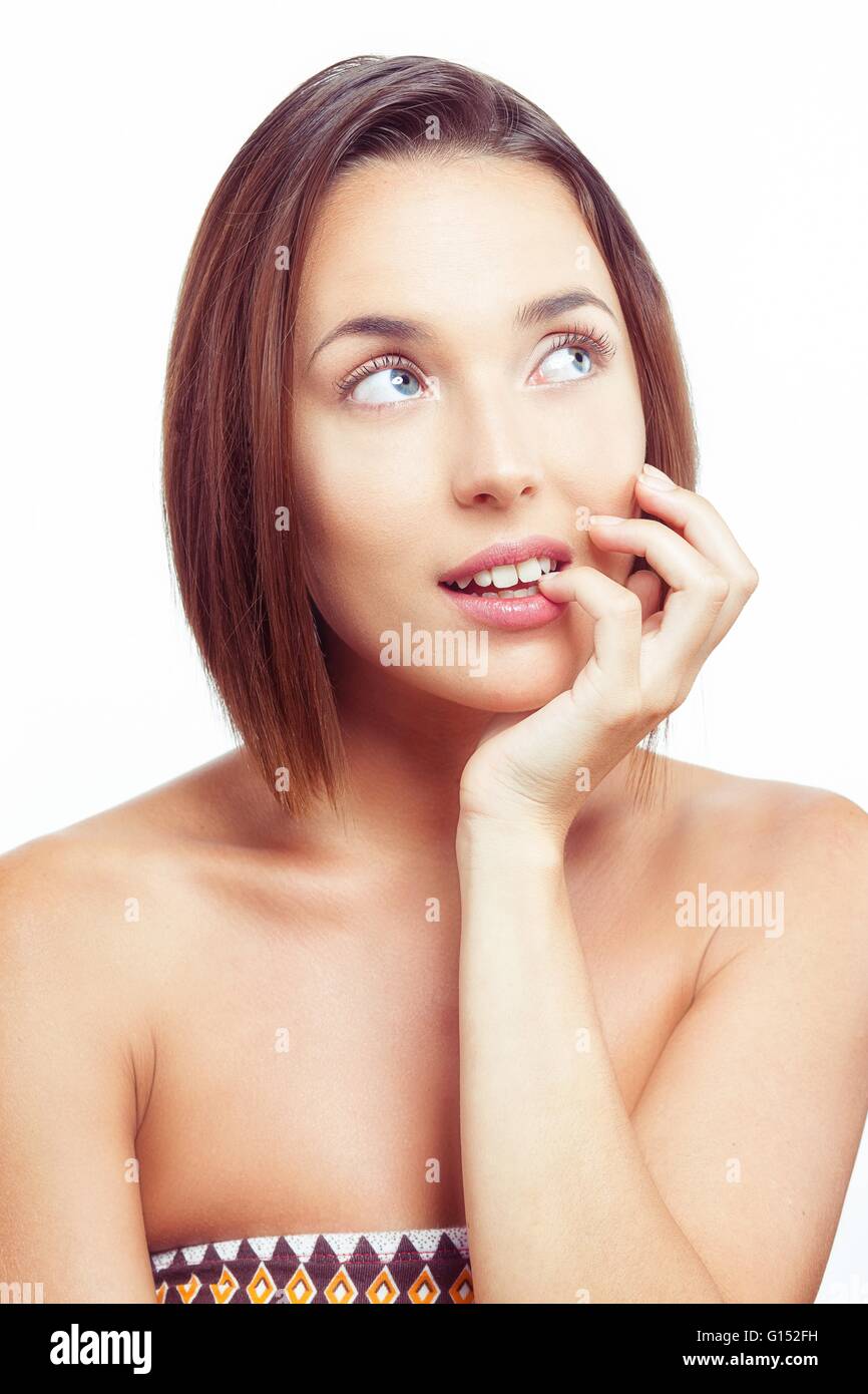 Giovane donna pensare guardando al lato Foto Stock