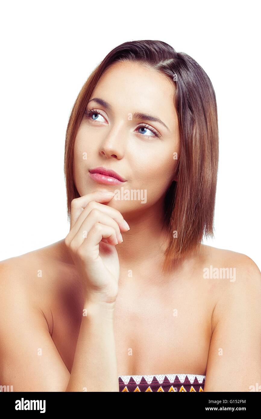 Giovane donna pensare guardando al lato Foto Stock