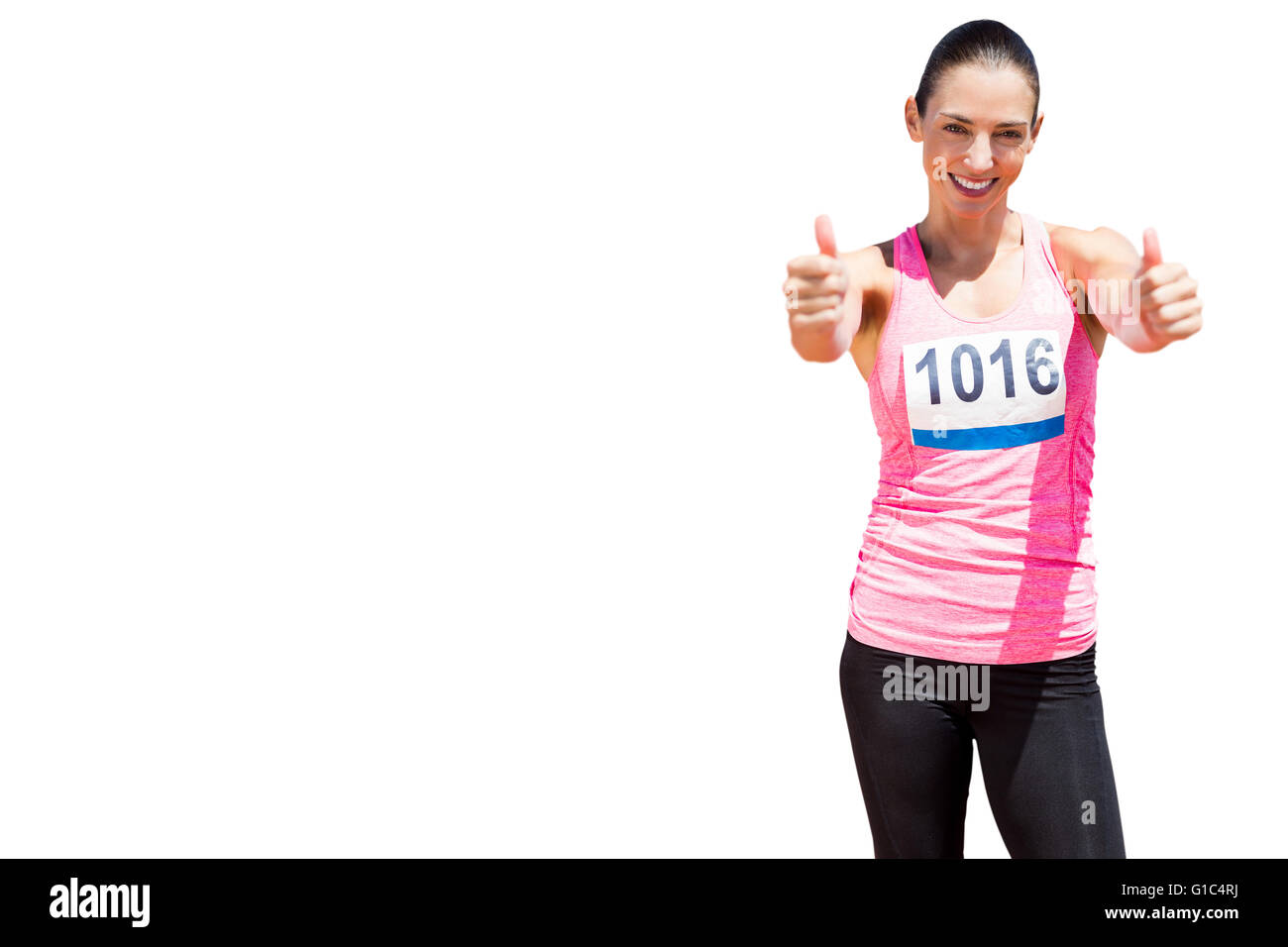 Atleta donna sorridente con il pollice in alto Foto Stock
