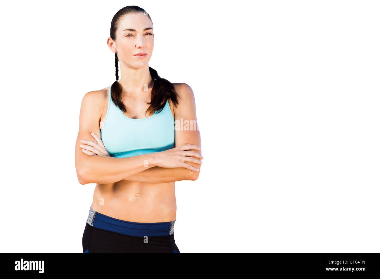 Sportivo da donna in posa con le braccia incrociate Foto Stock
