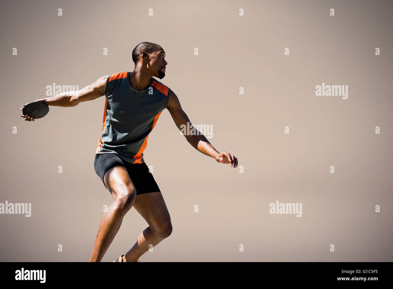 Immagine composita di atleta uomo gettando un discus Foto Stock