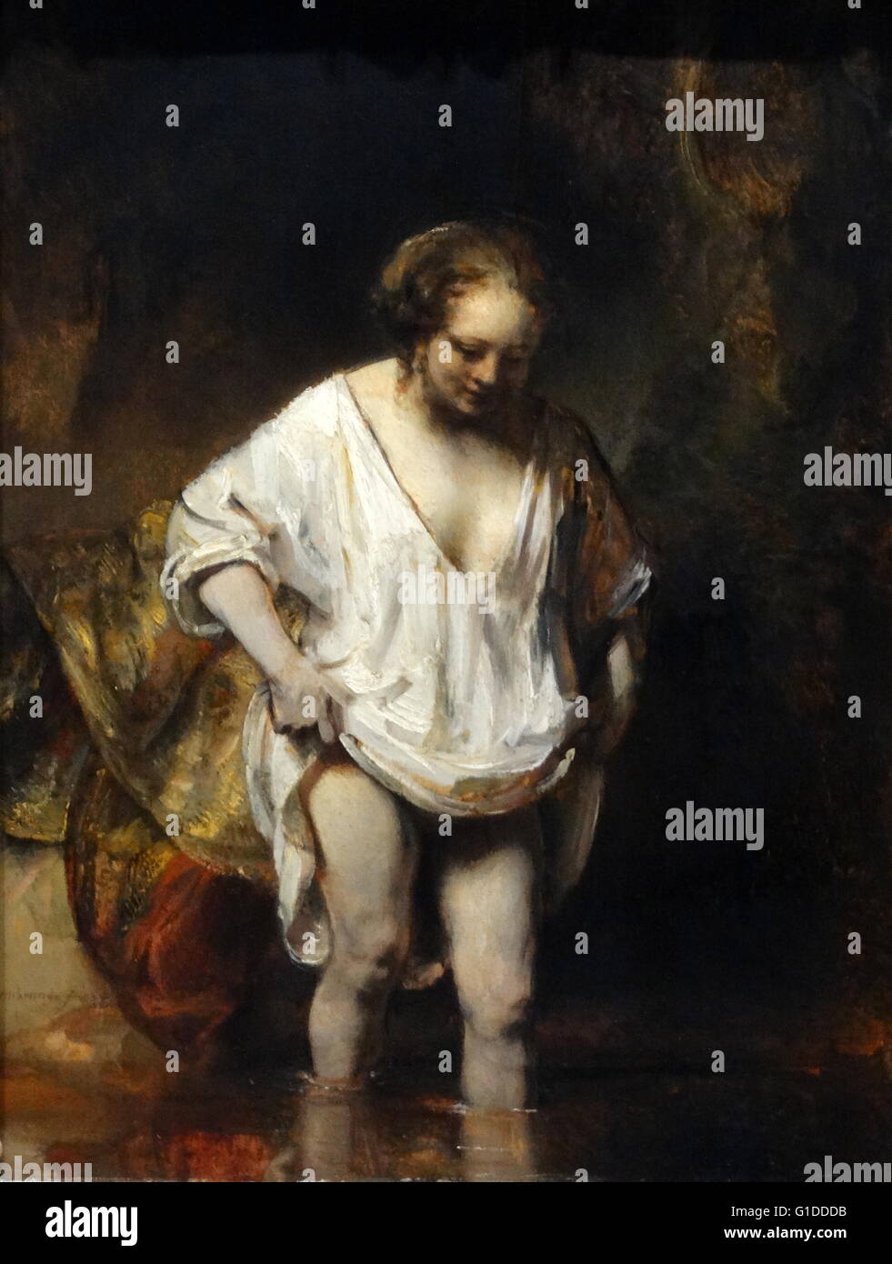 Pittura intitolata 'Una donna che faceva il bagno in un flusso' di Rembrandt Harmenszoon van Rijn (1606-1669) un pittore olandese e incisore. Risalenti al XVII secolo Foto Stock