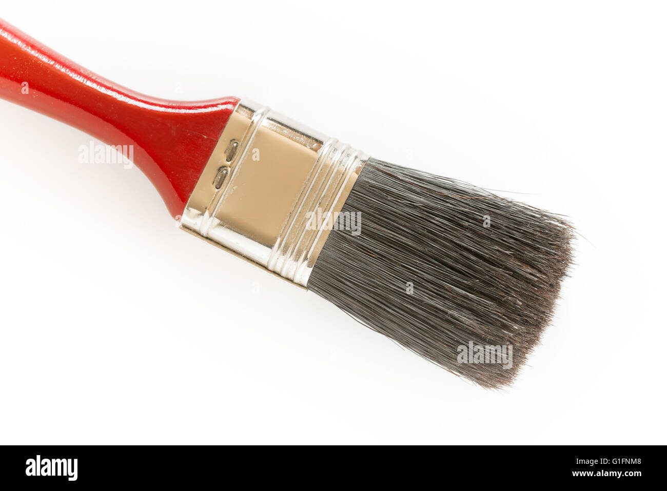 Dettaglio di un pennello rosso sable su sfondo bianco Foto Stock