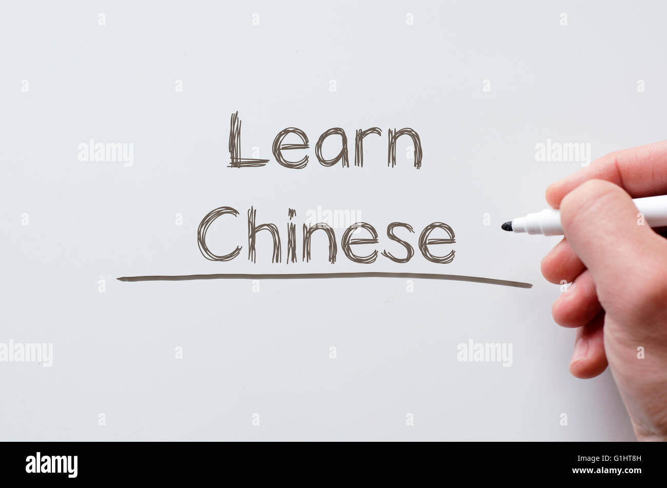 Mano umana la scrittura di imparare il cinese su whiteboard Foto Stock