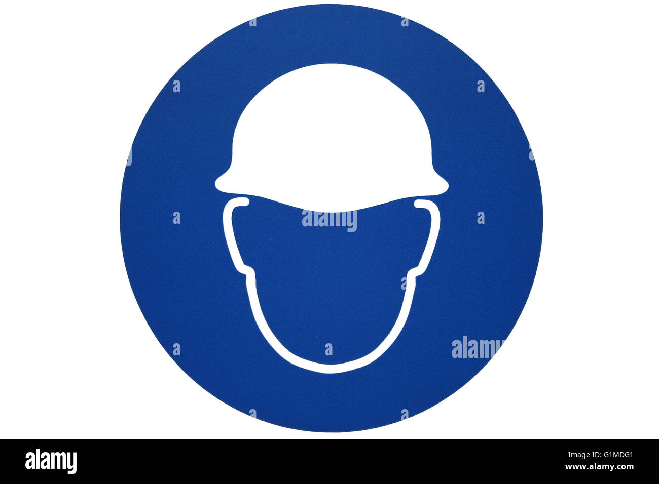 Un casco di sicurezza segno o motif che mostra un elmetto di sicurezza forma in bianco contro un azzurro sfondo circolare isolato su bianco Foto Stock
