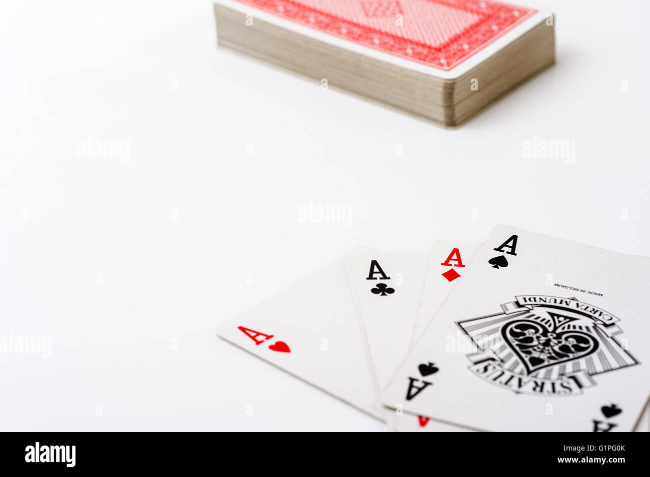 Quattro Assi e un pacco di carte da gioco. Foto Stock