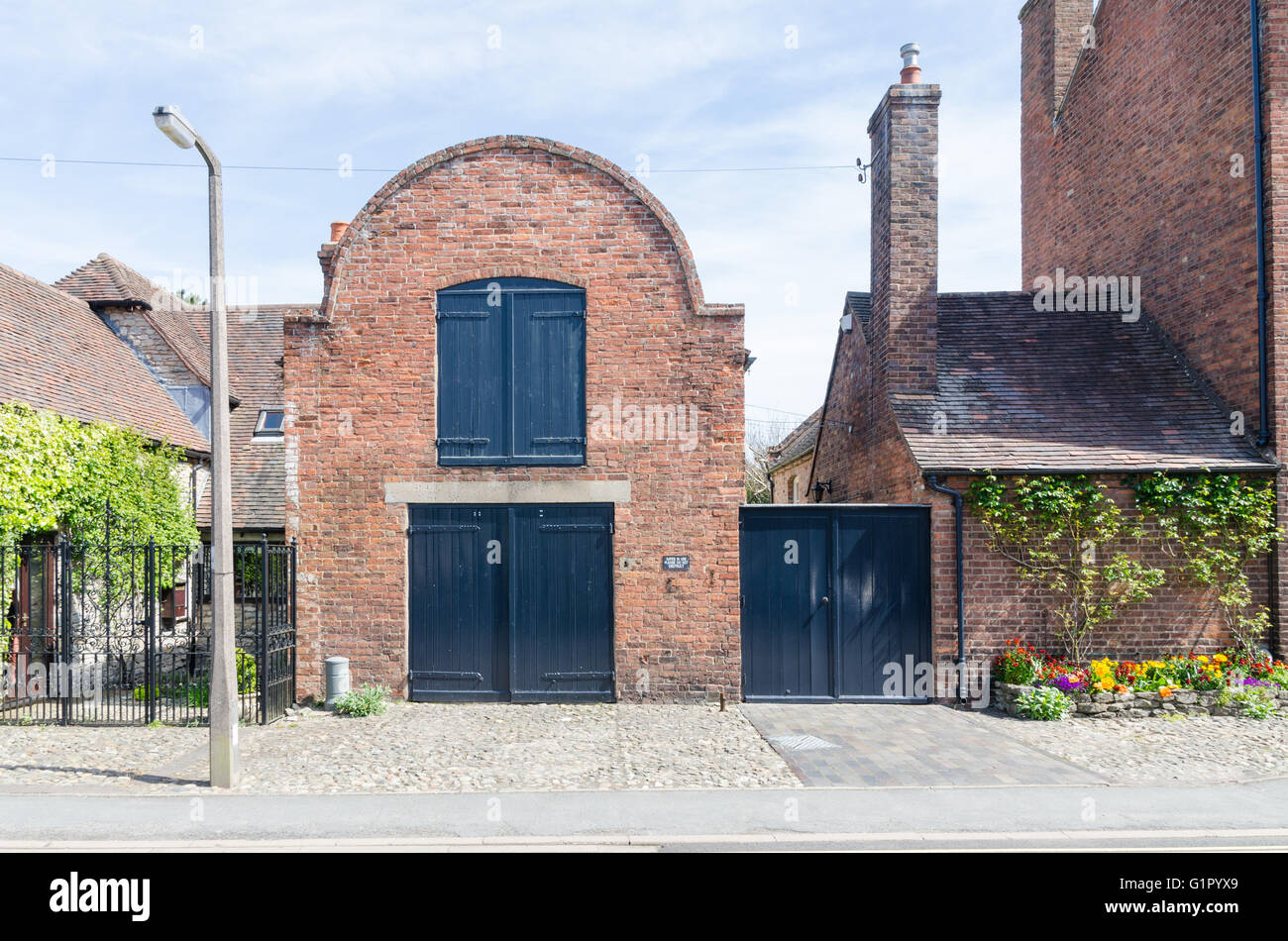 Vecchio a due piani coach house in Much Wenlock, Shropshire Foto Stock