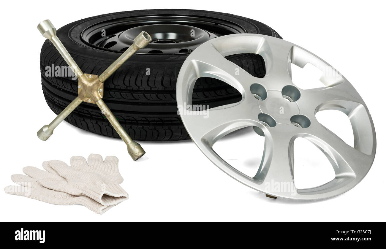 Pneumatico con un cacciavite, guanto e coppa ruota Foto Stock