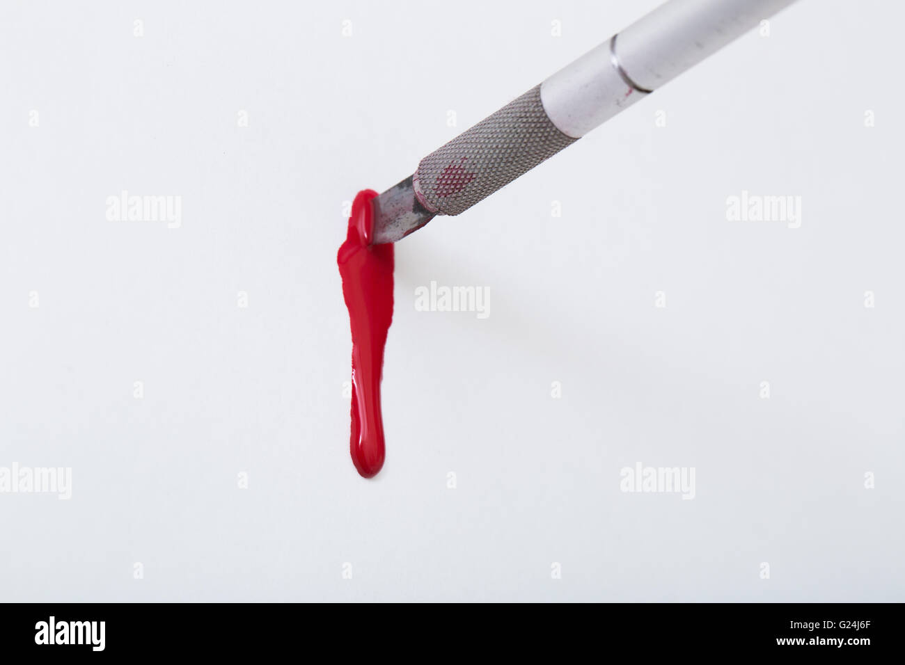 Bisturi affilata lama e sangue Foto Stock