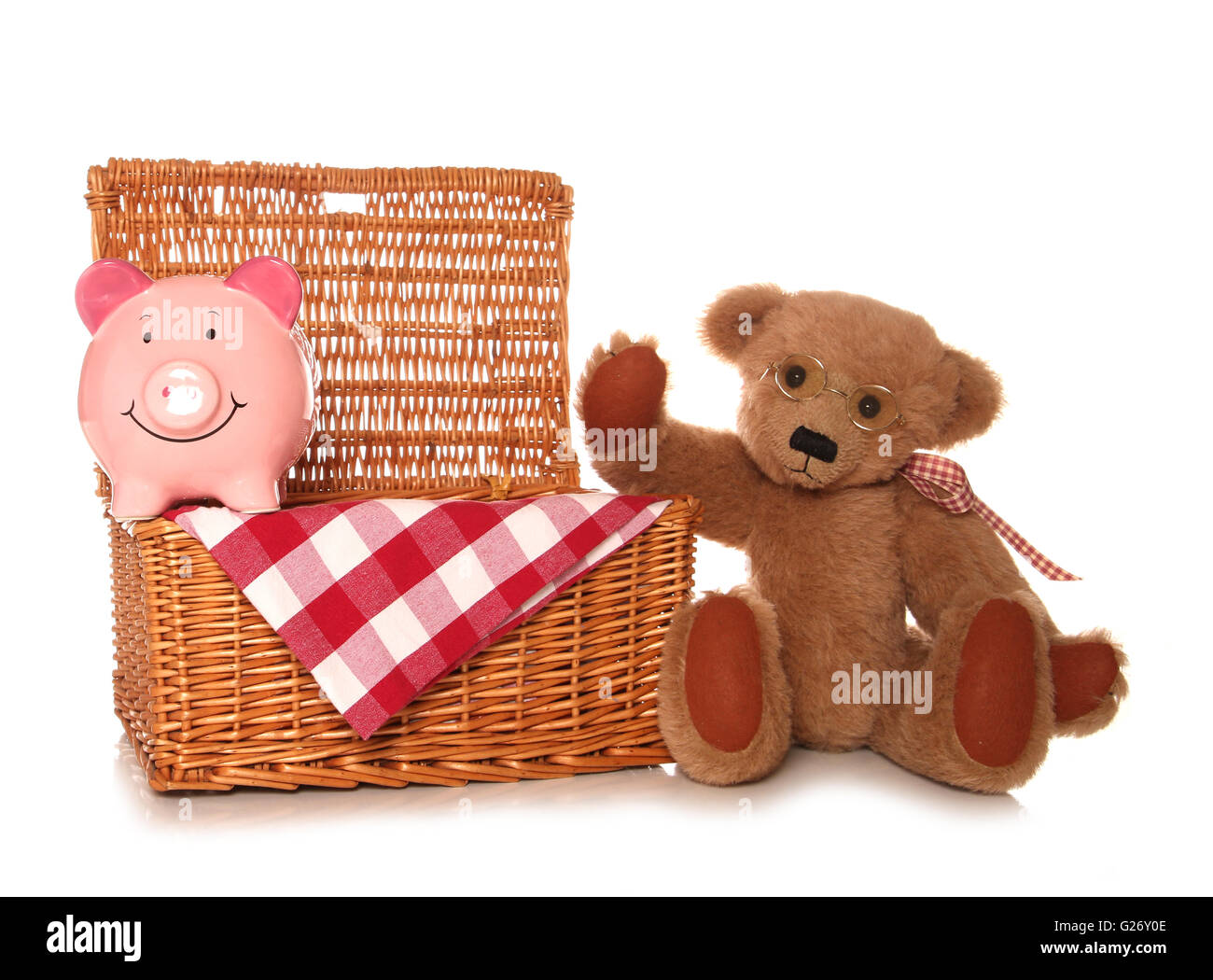 Risparmio di denaro su un orsacchiotto picnic ritaglio di partito Foto Stock
