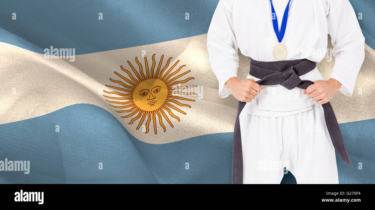 Immagine composita del fighter in posa con medaglia intorno al suo collo Foto Stock