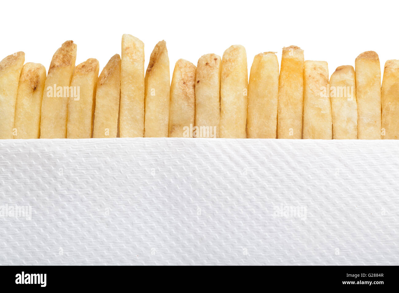 Fila di patatine fritte e tovagliolo di carta Foto Stock