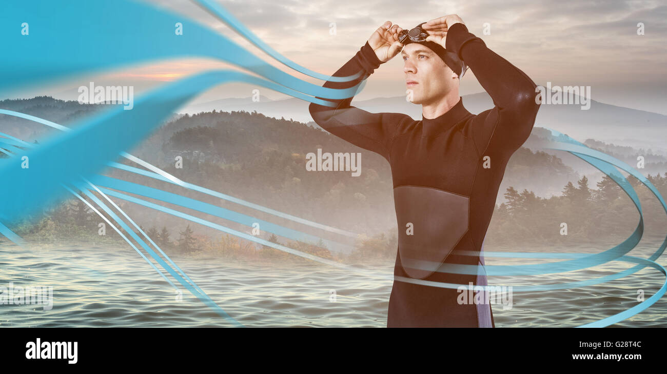 Immagine composita del nuotatore in wetsuit indossando occhiali da nuoto Foto Stock