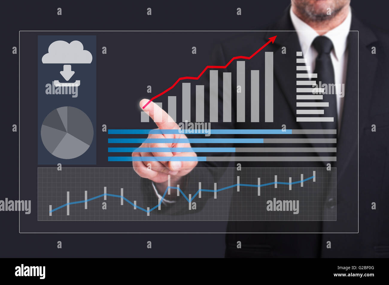 Imprenditore premendo sul digitale trasparente schermo futuristico con crescente grafici finanziari Foto Stock