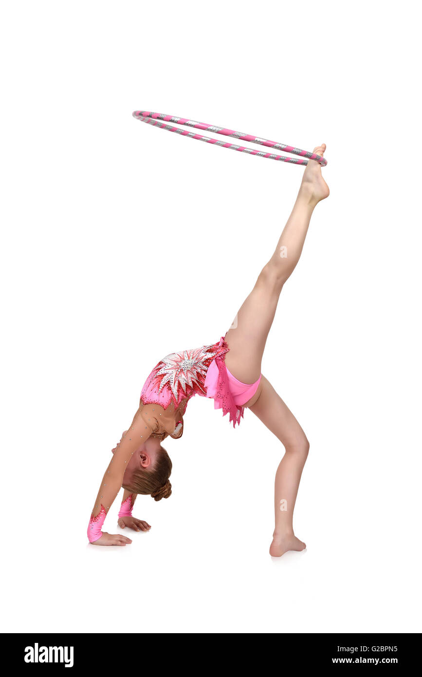 Atleta artistico esegue in abiti rosa con hula hoop Foto Stock